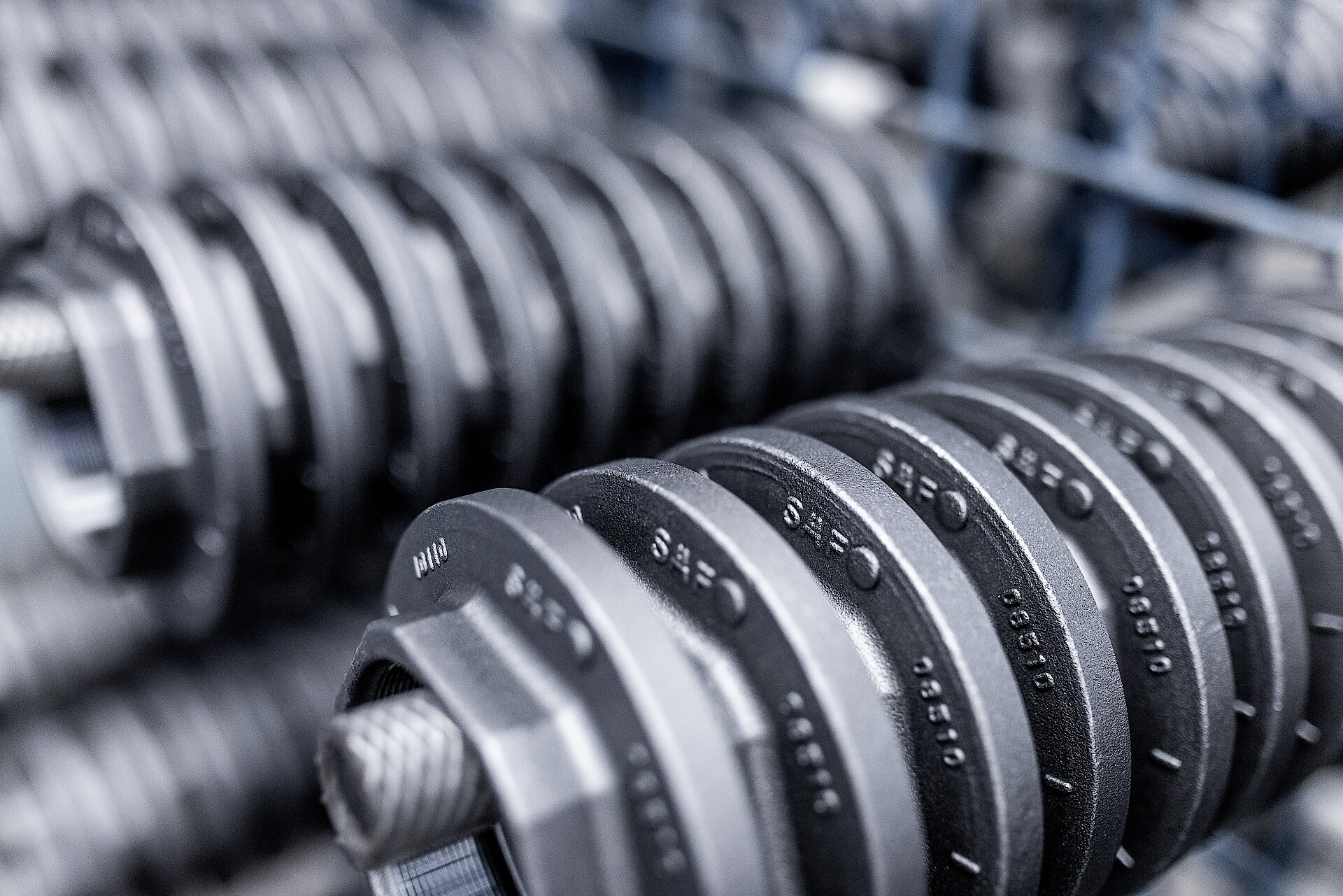 Row of cast metal components embossed with the SAF lettering