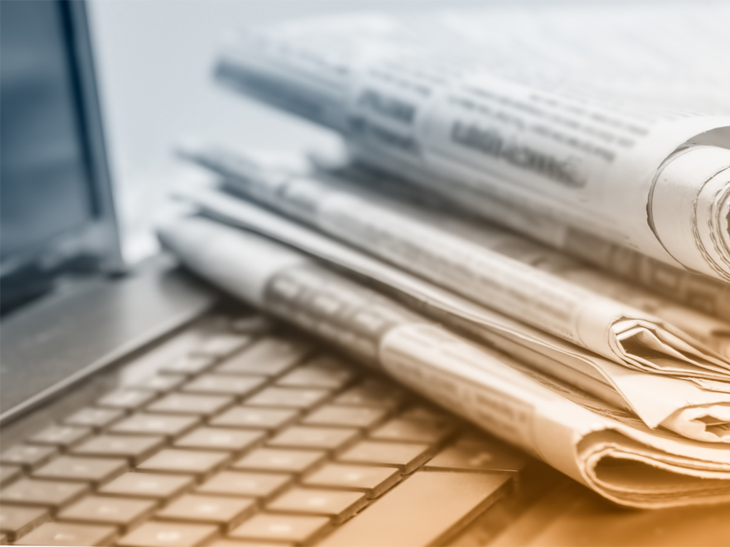 laptop and newspaper